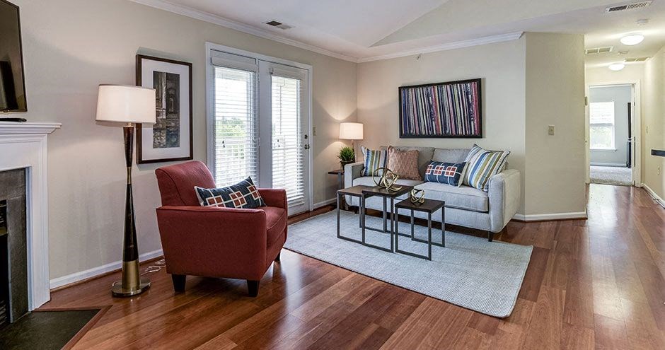 a living room filled with furniture and a fire place at SomerHill Farms Apartments, Virginia , 20155