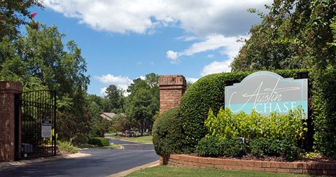 A sign that says property name at Austin Chase Apartments, Macon