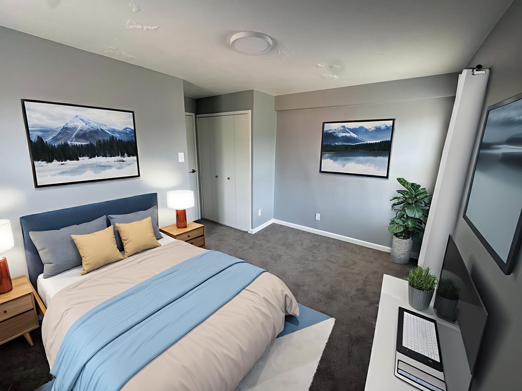 A bedroom with a large bed and a painting of a mountain on the wall.
