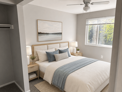 A bedroom with a large bed and a painting on the wall.