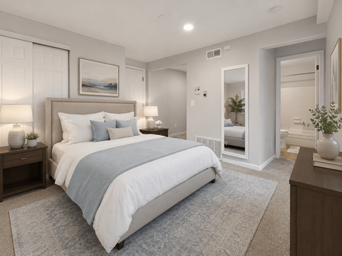 A bedroom with a large bed and a painting on the wall.