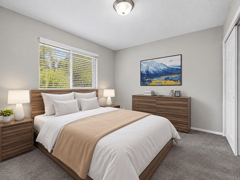 A bedroom with a large bed and a painting on the wall.