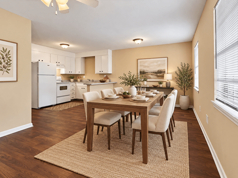 A dining room with a table set for six people.