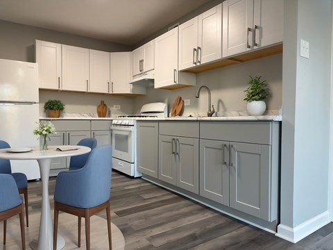 A kitchen with a table and chairs. at The Langston Views, Washington, 20020