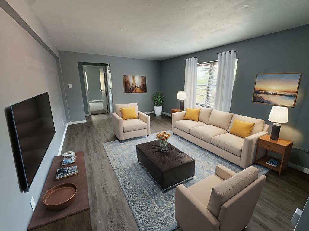 A living room with a couch, chair, and coffee table.