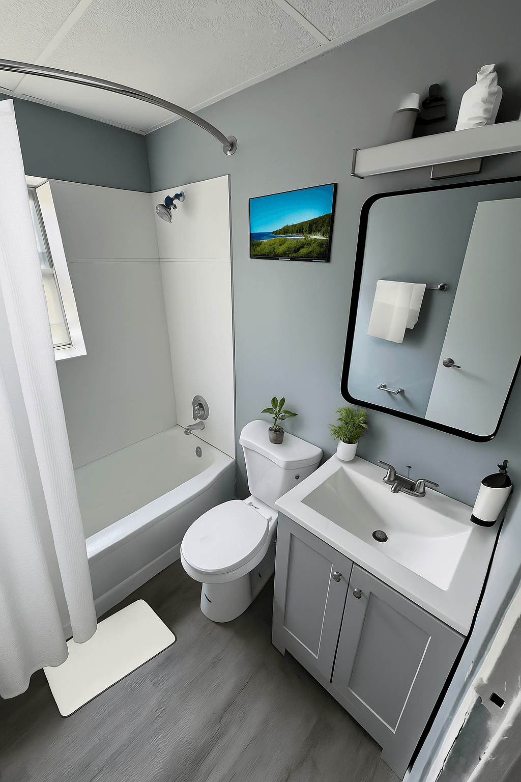 A small white toilet sits next to a sink in a small bathroom.