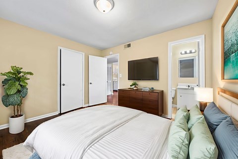 Bedroom with ensuite bathroom and wall mounted tv at Signature Collection Apartments, Alabama, 35405