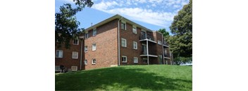 Green lawn in front of Building at The Terraces at Dekalb, Illinois