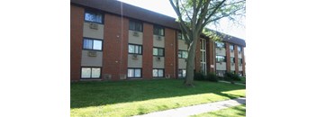 Building Exterior with Greenery Around at The Terraces at Dekalb, Dekalb, Illinois