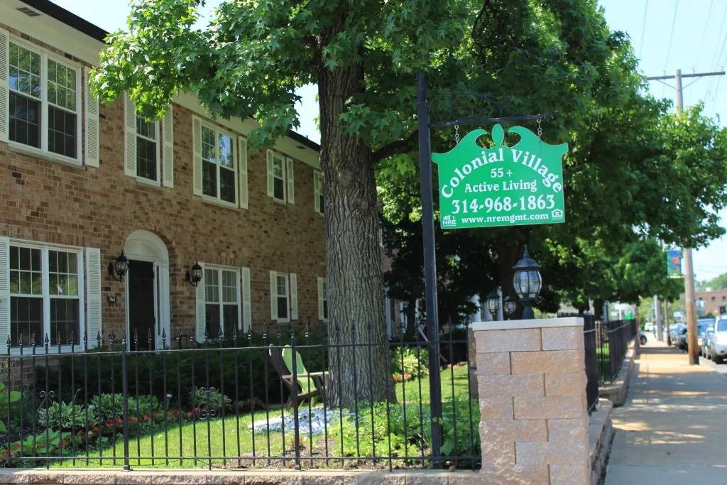 a sign on a pole in front of a building