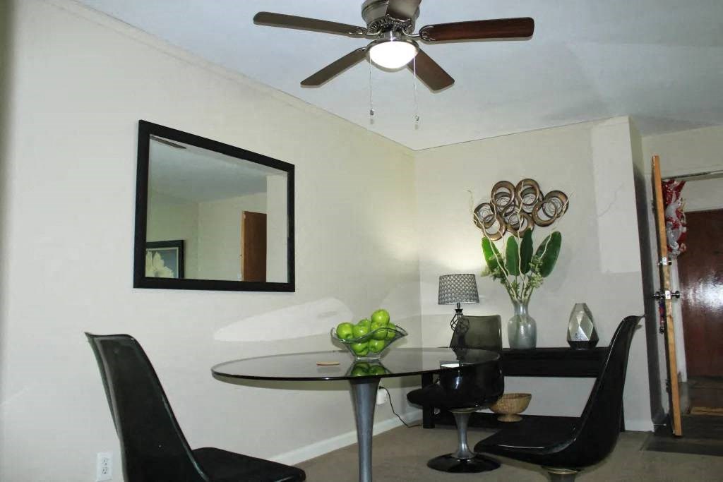 a dining room with a table and chairs