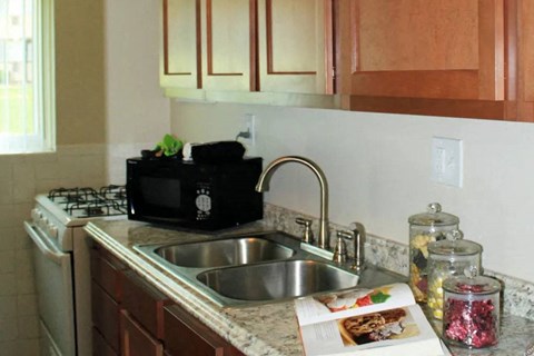 a kitchen with a sink and a microwave