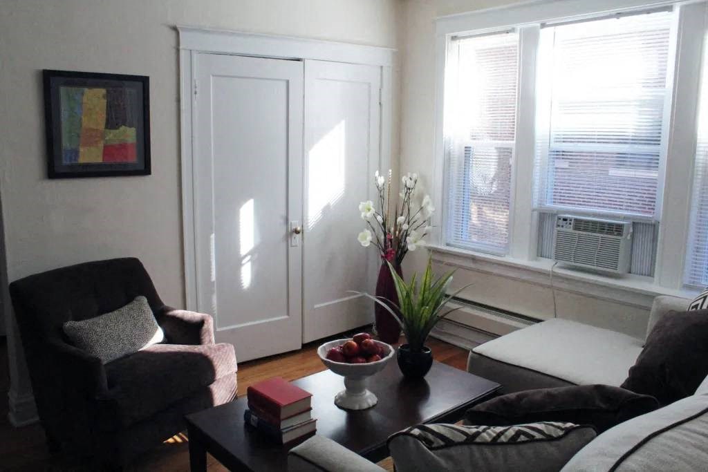 a living room with a couch and a chair