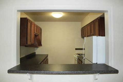 a kitchen with a counter top and a refrigerator