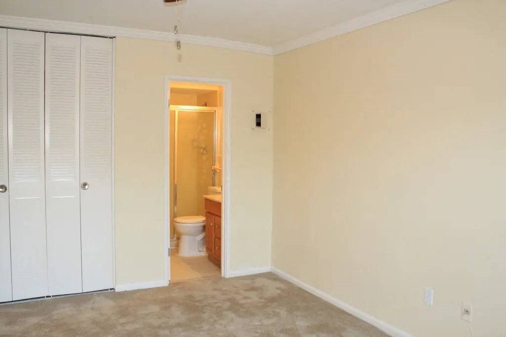 a room with a toilet and a sink in it