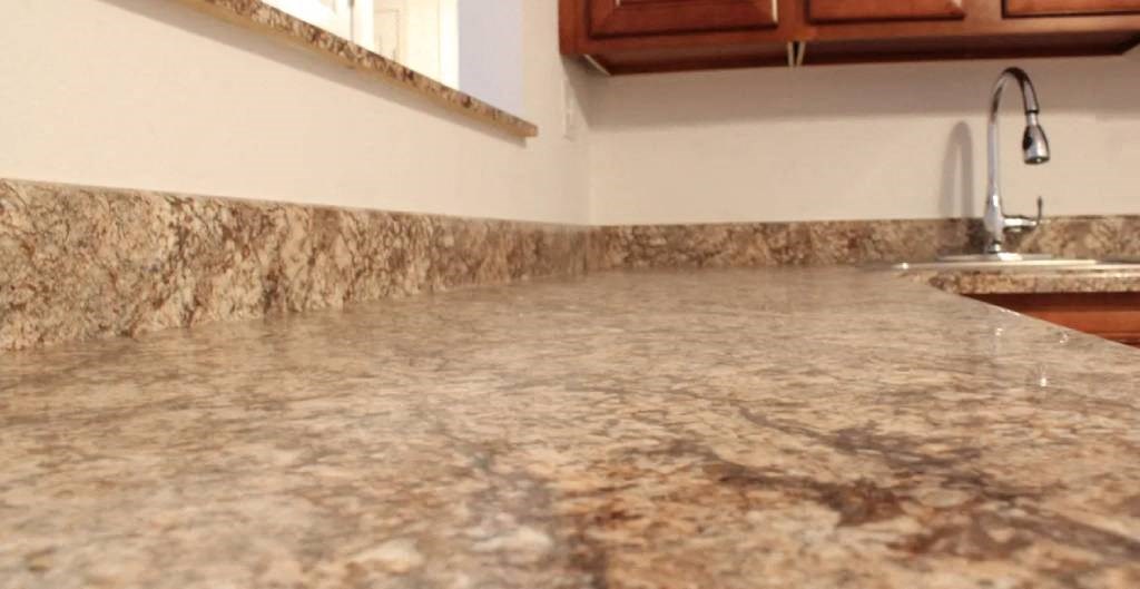 a kitchen with a counter top and a sink