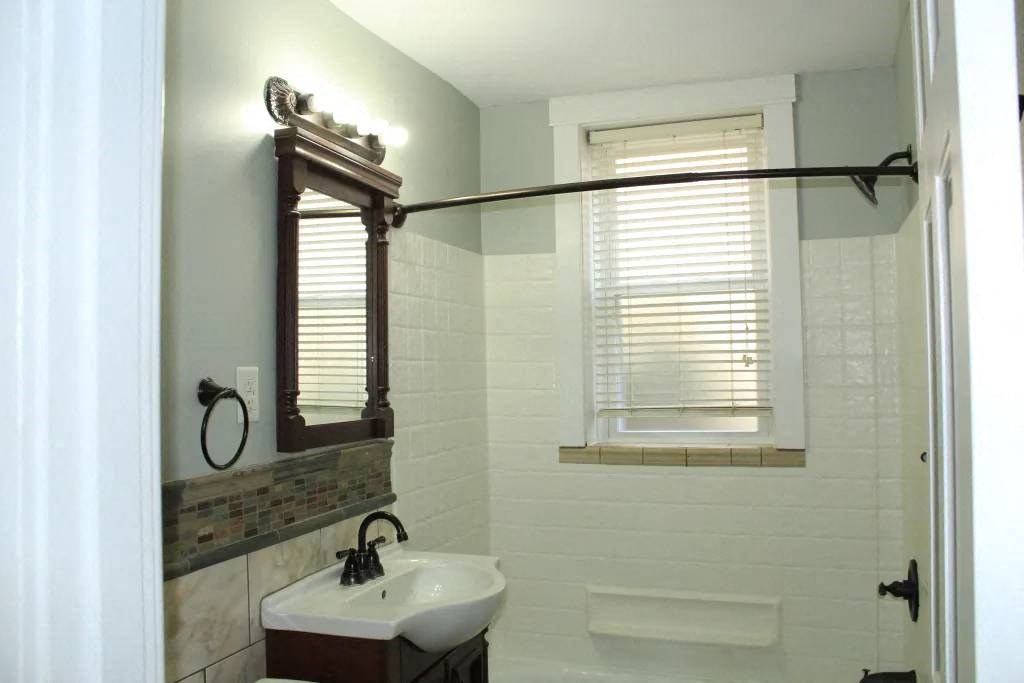 a bathroom with a sink and a mirror