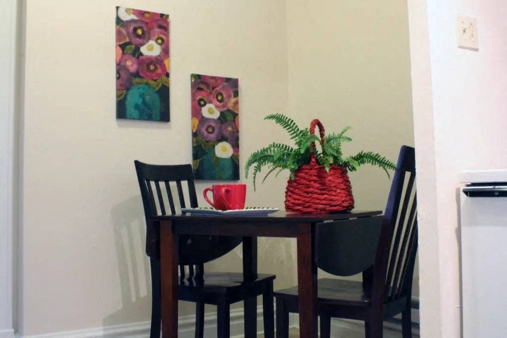 a table and chairs in a small room