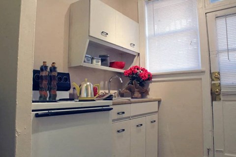 a small kitchen with a sink and a window
