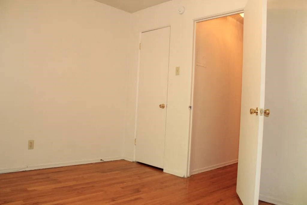 an empty room with a door open