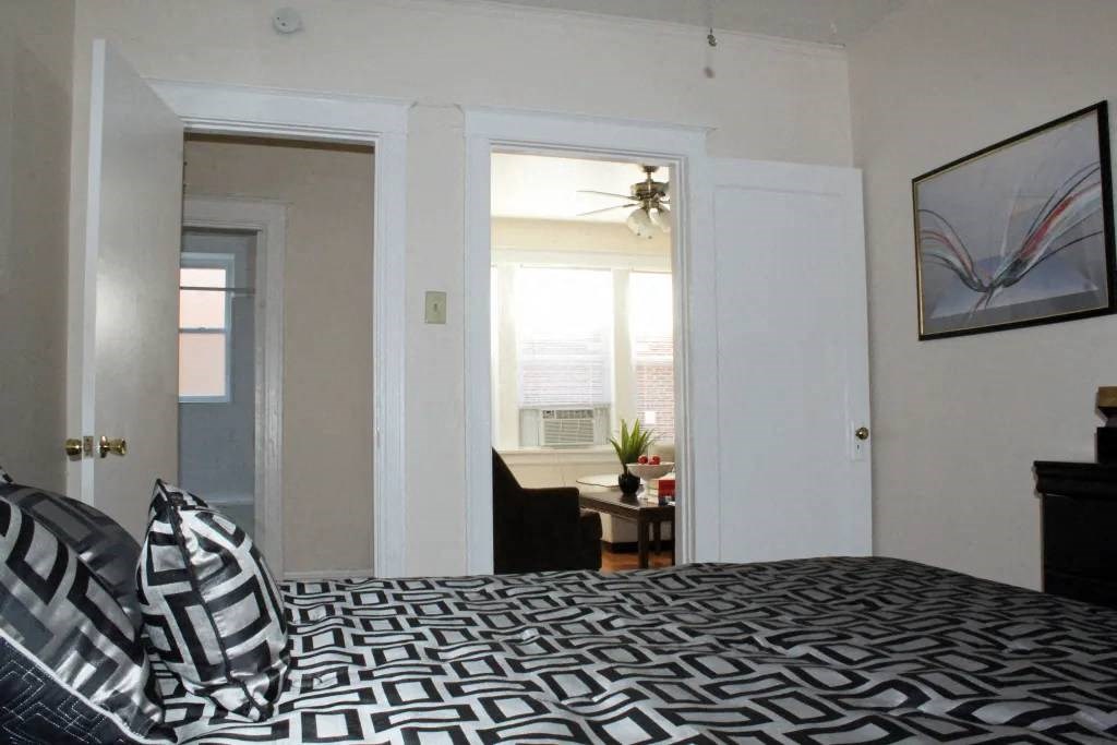 a bedroom with a bed and a window