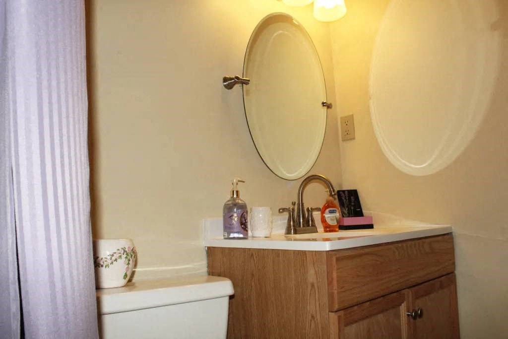 a bathroom with a toilet and a sink