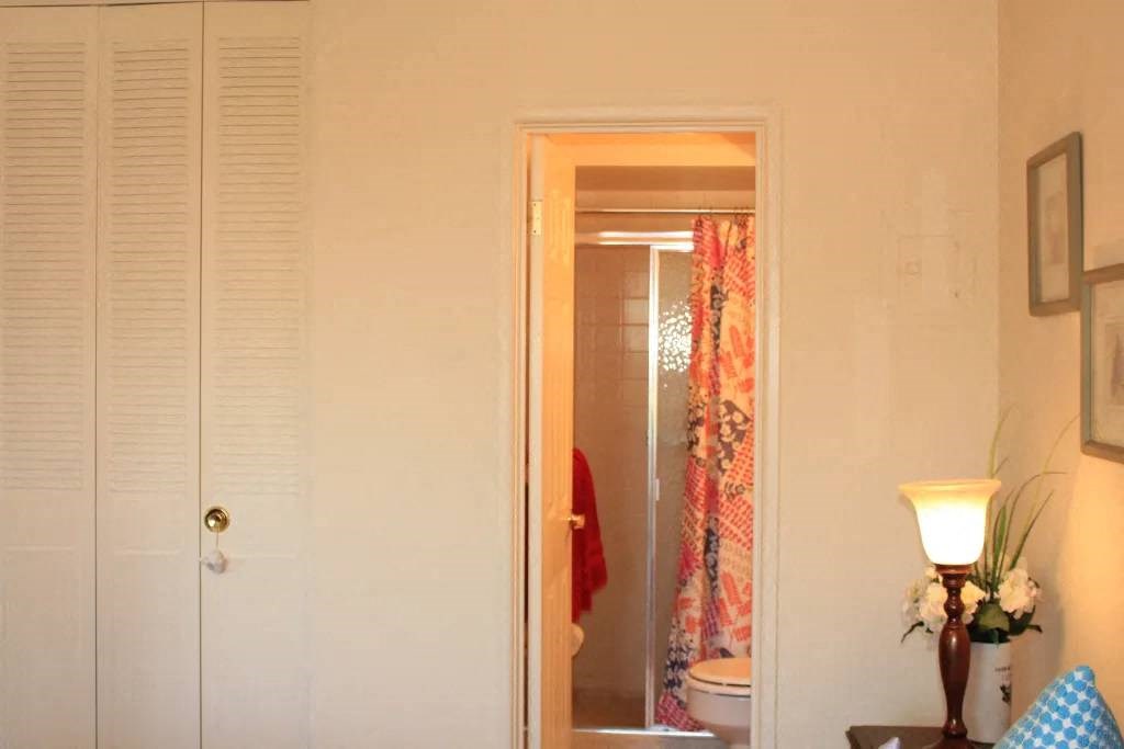 a bathroom with a toilet a sink and a mirror