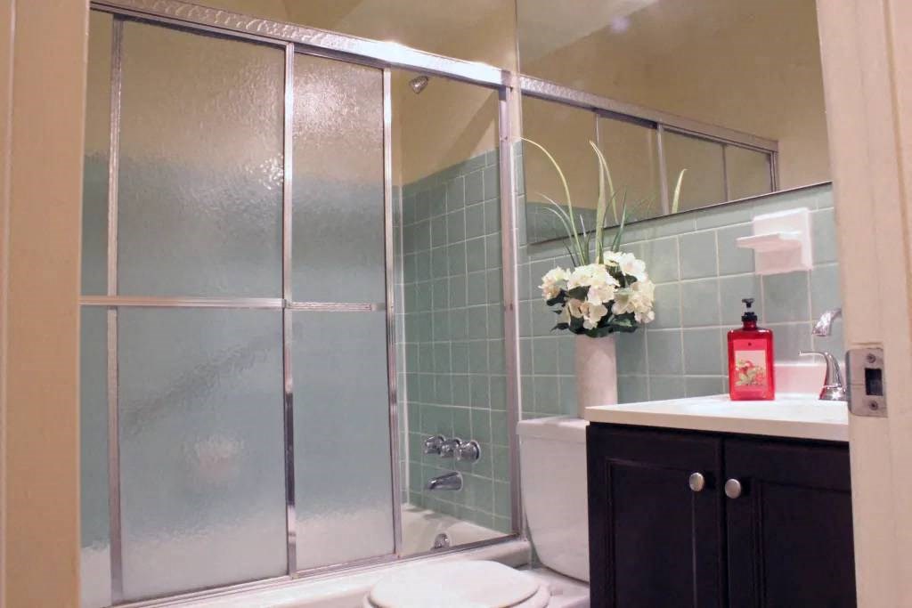 a bathroom with a sink toilet and shower