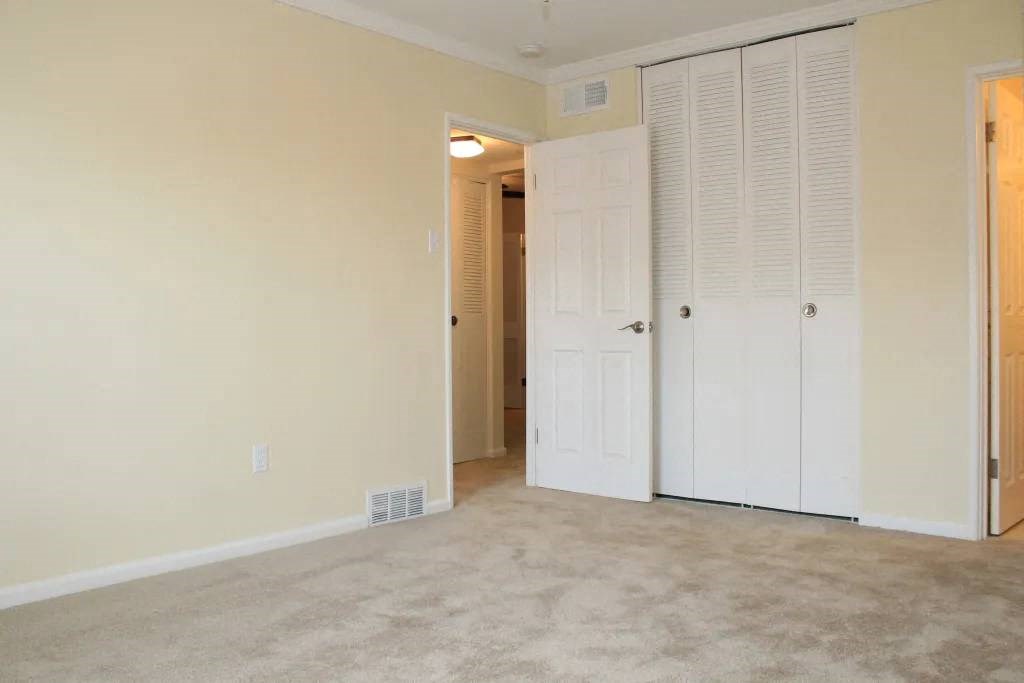 an empty room with a door open
