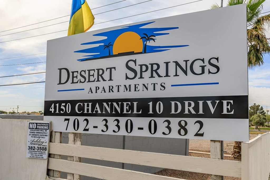 a sign that reads desert springs apartments 4490 chanel 10 drive