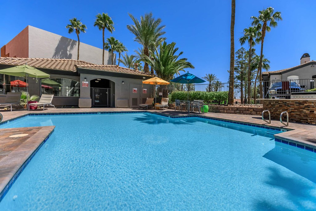 the swimming pool at a resort style hotel with a large pool