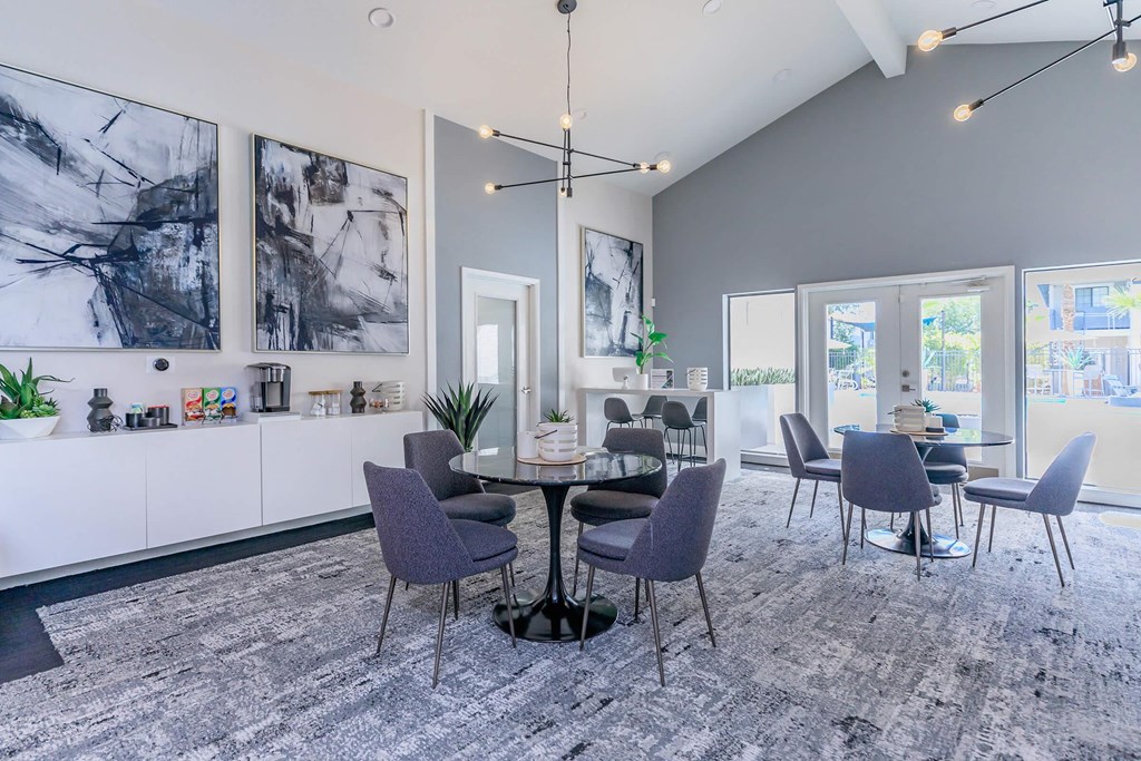 a dining room with purple chairs and a table