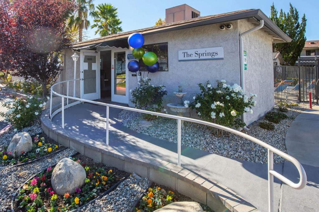 the springs preschool building with flowers and balloons