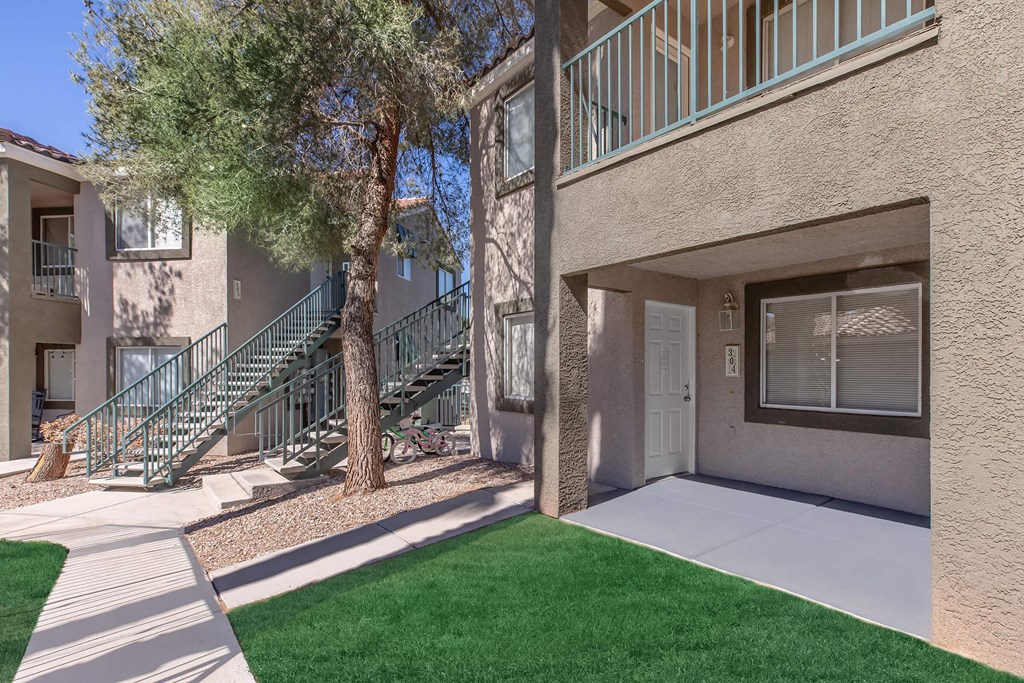 our apartments have a spacious courtyard with grass and trees