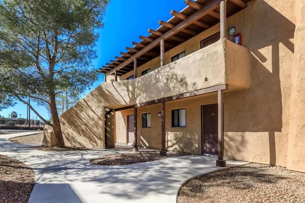 A modern building with a flat roof and a concrete facade.
