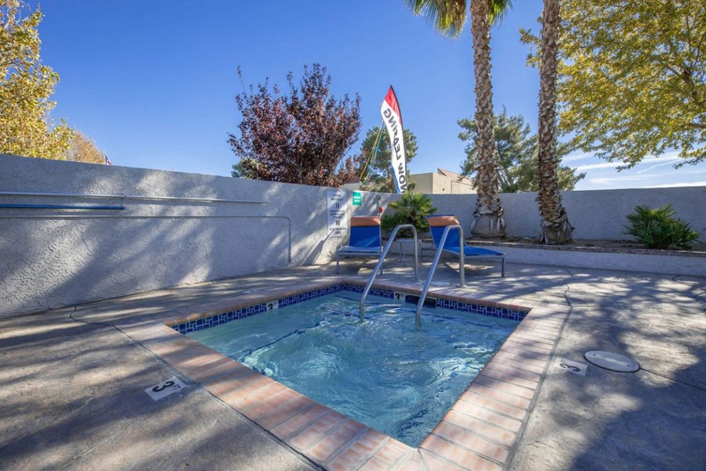 the pool is in the backyard of the house