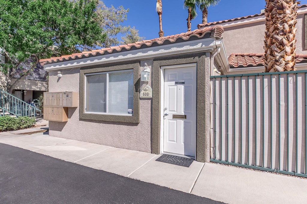the front of a house with a white door