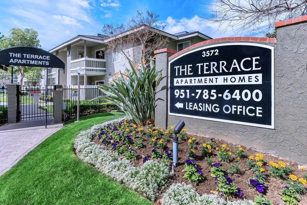 the terrace apartment homes sign in front of building