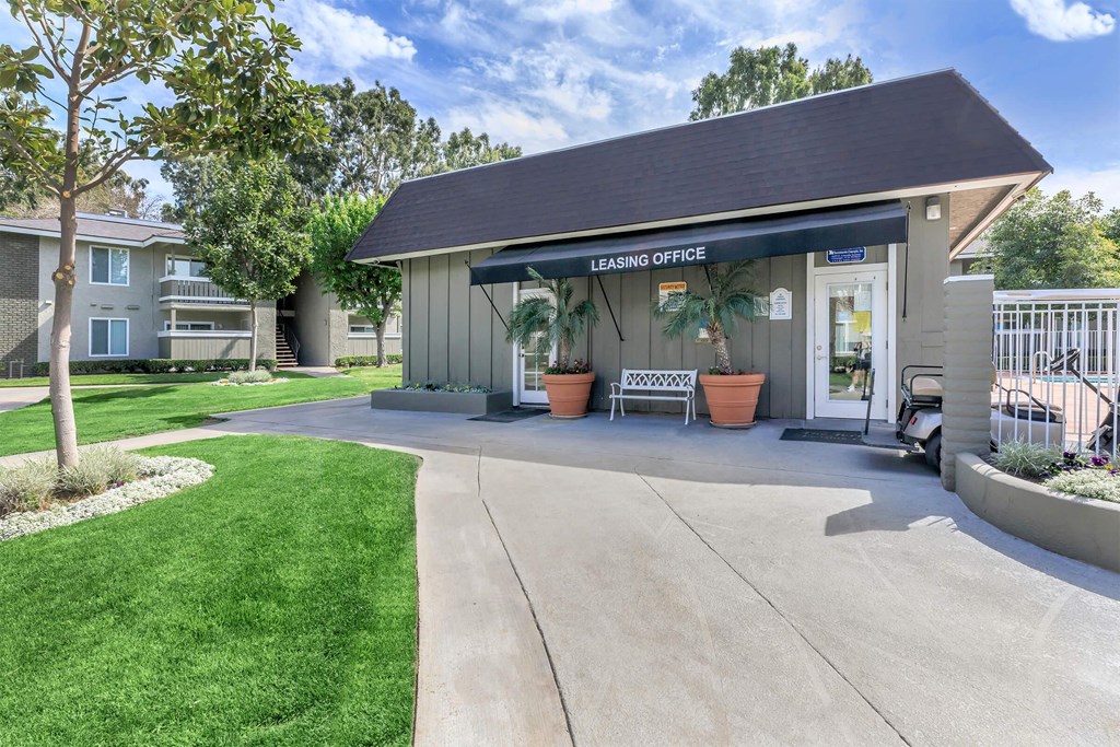 the entrance to the leasing office at the whispering winds apartments tx