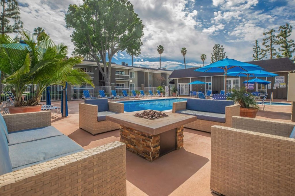 our apartments have a pool and lounge areas with umbrellas