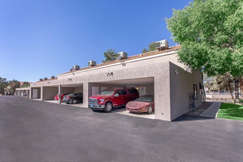 a building with three cars parked in front of it