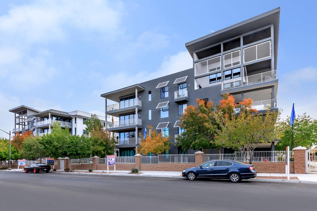 a rendering of an apartment building on the corner of a street