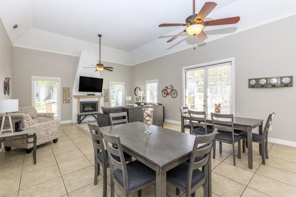 a dining room and living room with a table and chairs