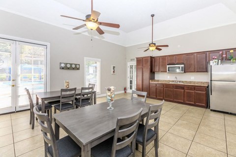 a dining room with a table and chairs