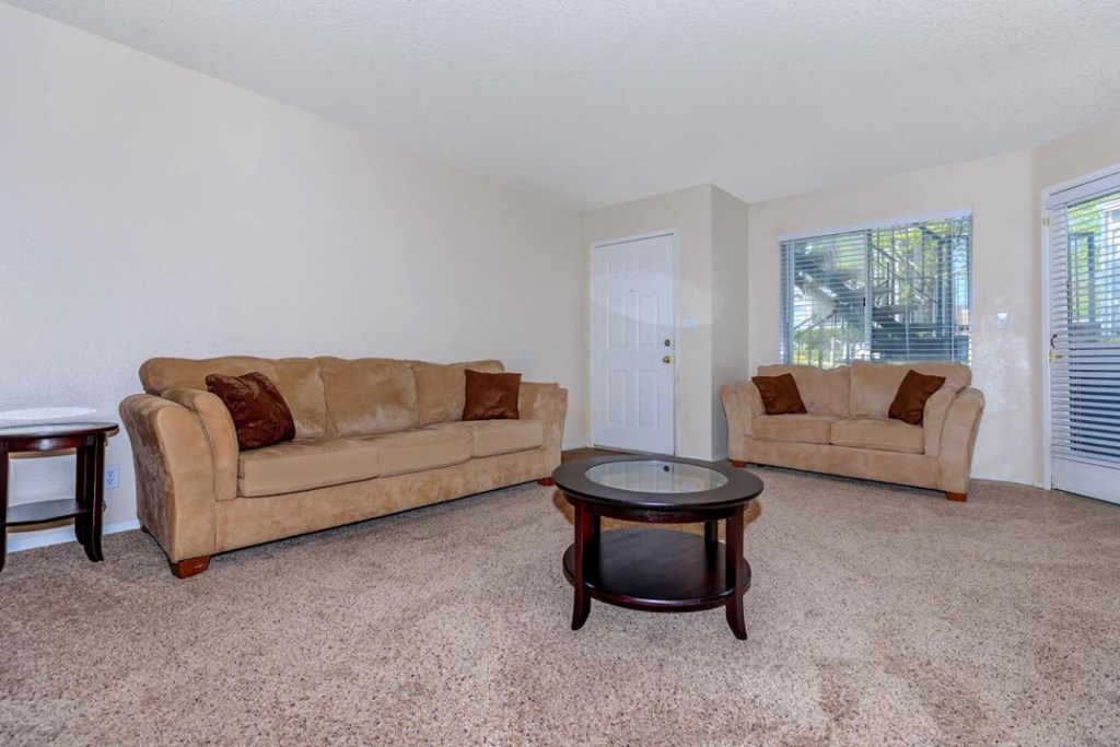 a living room with two couches and a coffee table