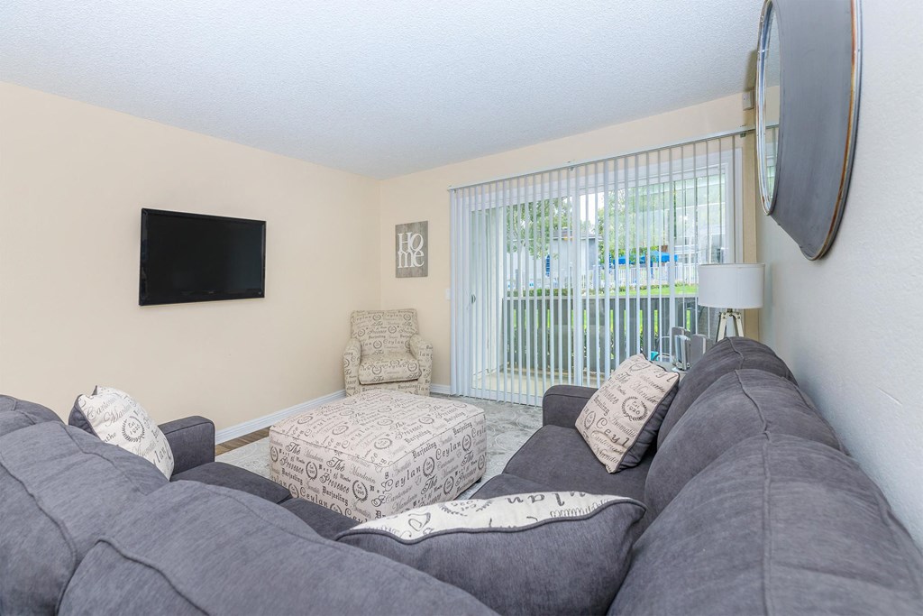 a living room with a couch and a television