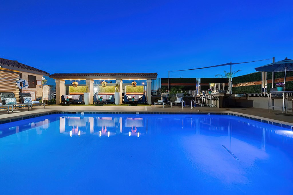 the swimming pool at the resort at dusk