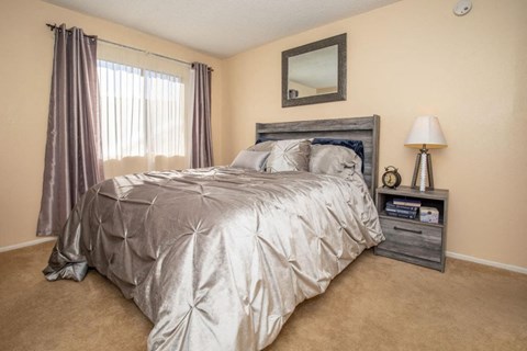 a bedroom with a bed and a window