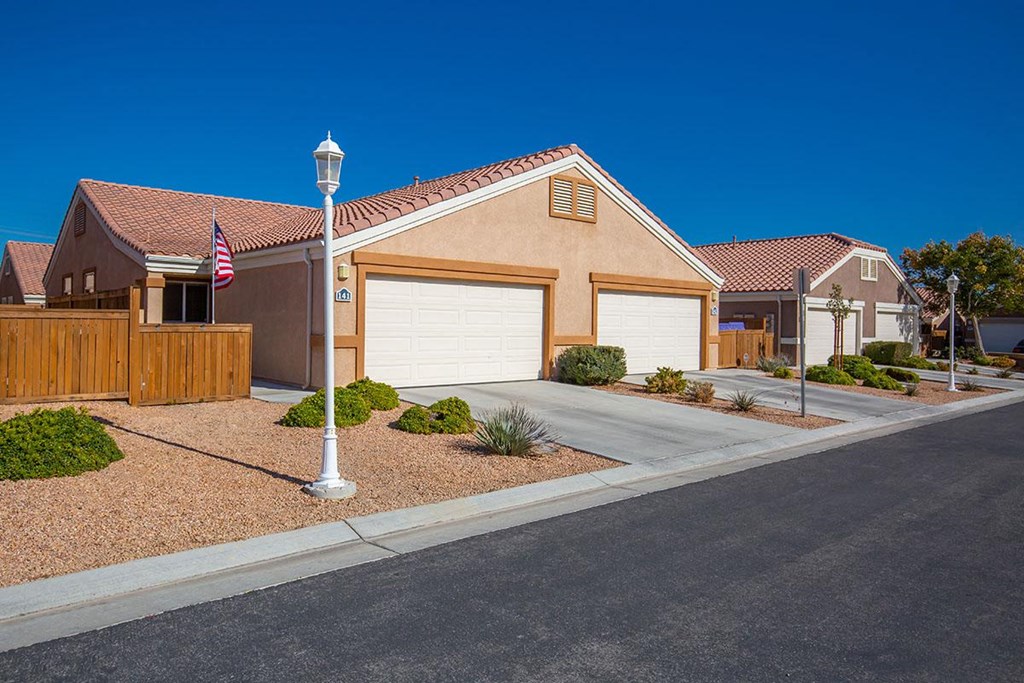 a house with a flag on the side of a street