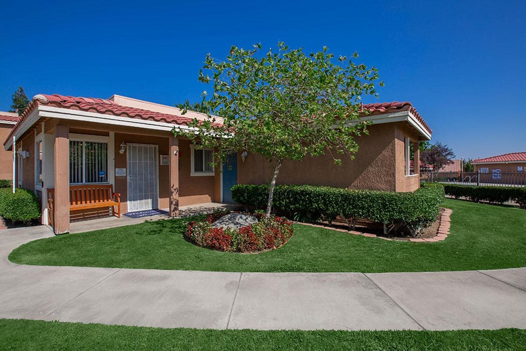 a house with a tree in the front of it
